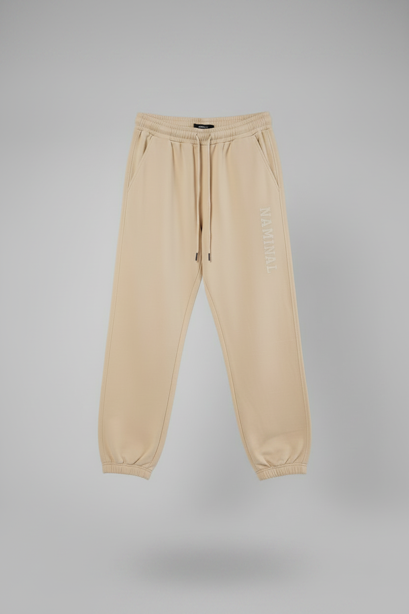 Beige sweatpants on a gray background
