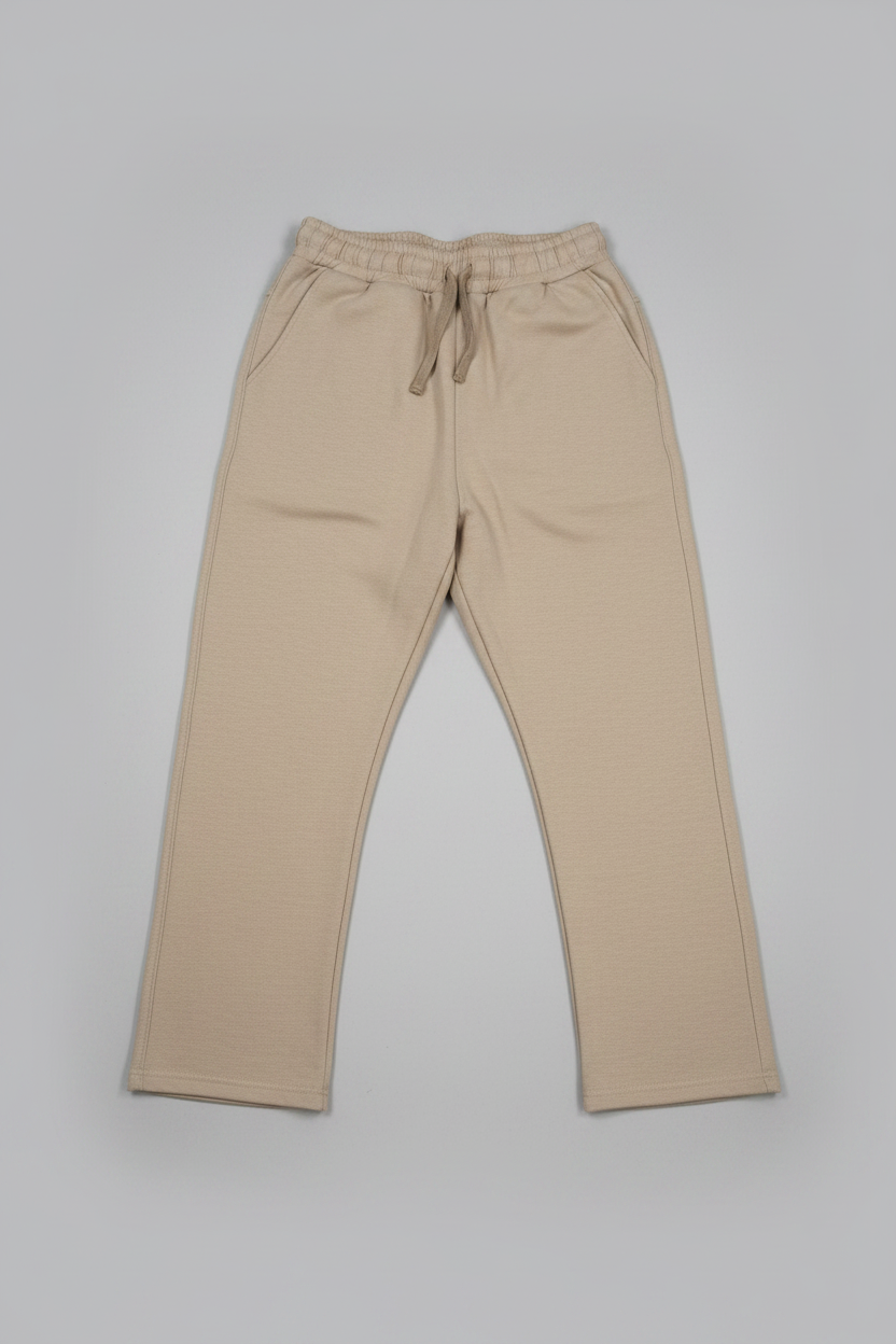 Beige pants with drawstring on a light gray background