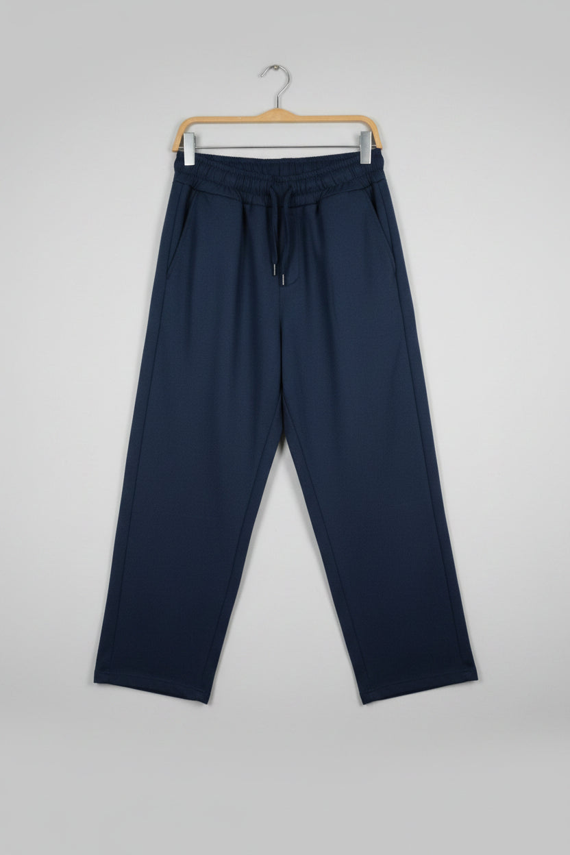 Navy blue pants on a wooden surface