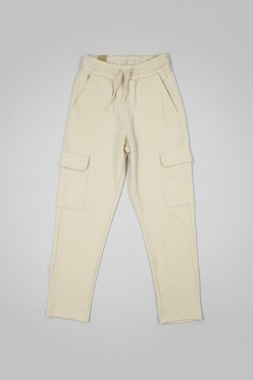 Beige cargo pants on a gray background