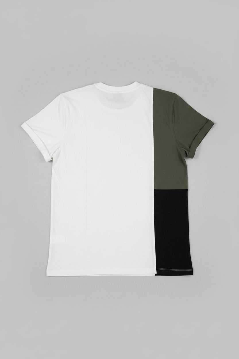 Color-blocked t-shirt with white, green, and black sections on a gray background